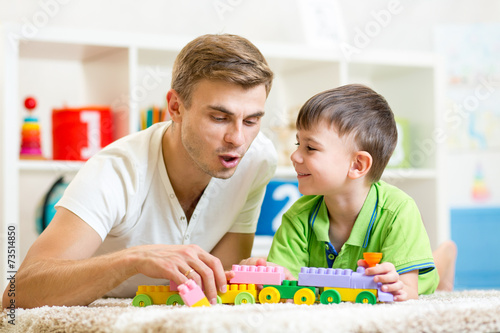daddy with his kid son play together