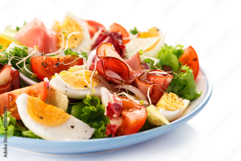 Boiled eggs with smoked ham and vegetables