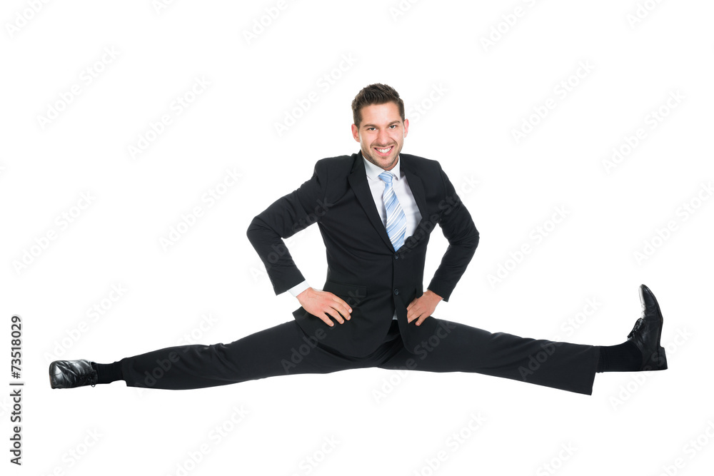 Businessman Doing Splits Over White Background