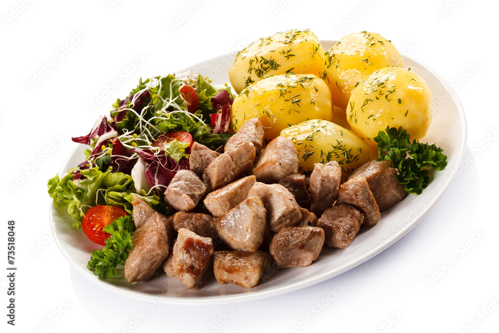 Grilled meat with boiled potatoes and vegetables Grilled meat with boiled potatoes and vegetables