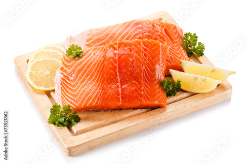 Fresh raw salmon fillet on cutting board