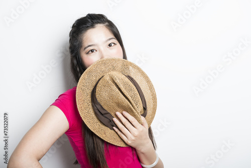 Smiling asian girl with arms crossed