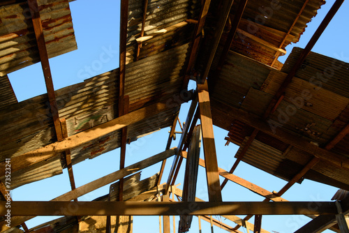 Broken and destroyed roof of an old house