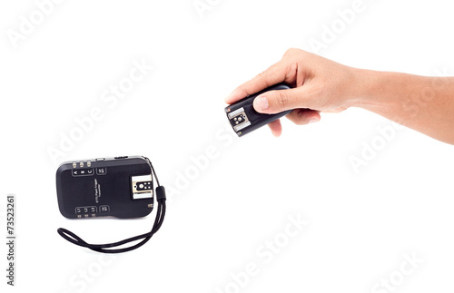 Wireless Flash Trigger in hand, Isolate on white background