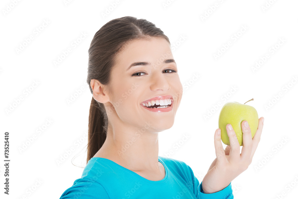 Portrait of happy woman holding an apple Portrait of happy woman holding an apple