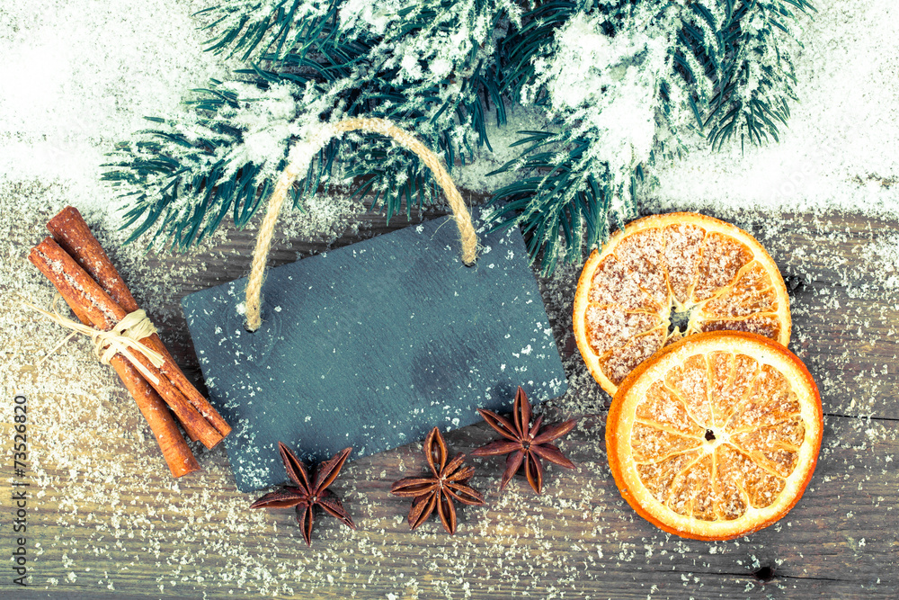 Christmas decoration with slate board, over wooden background