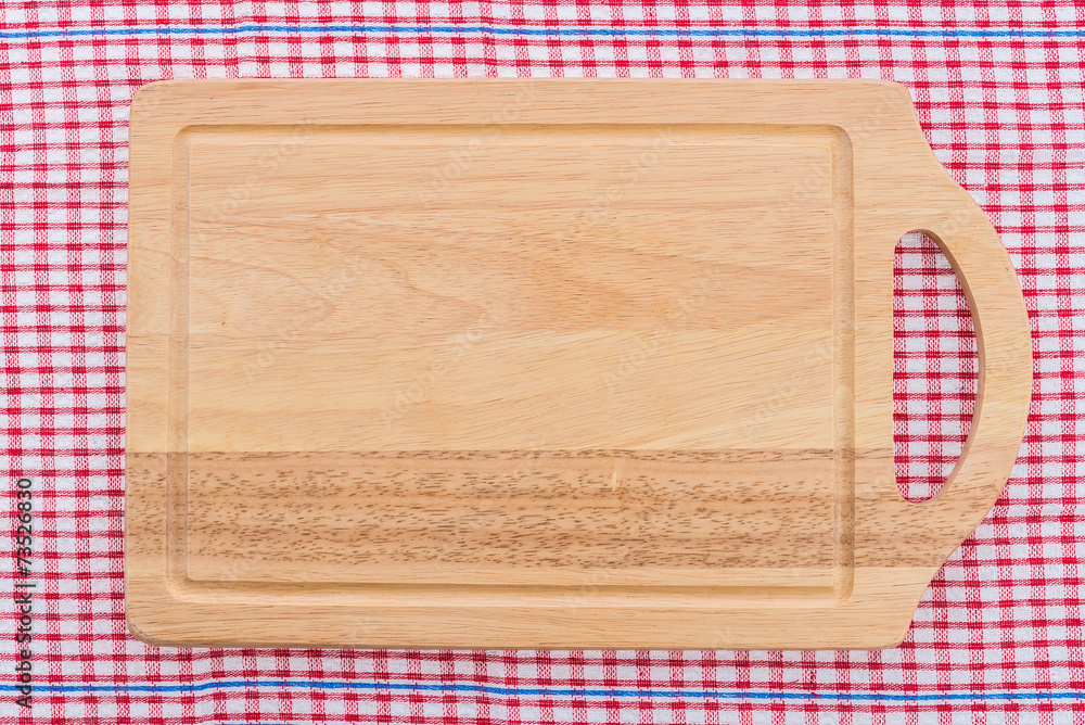 wood cutting board on tablecloth wood cutting board on tablecloth