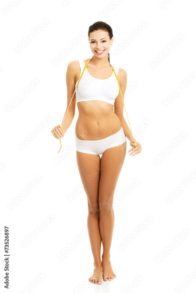 Caucasian woman with measuring tape around neck Caucasian woman with measuring tape around neck