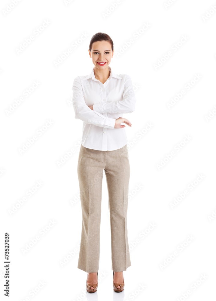 Full length young businesswoman with folded arms Full length young businesswoman with folded arms