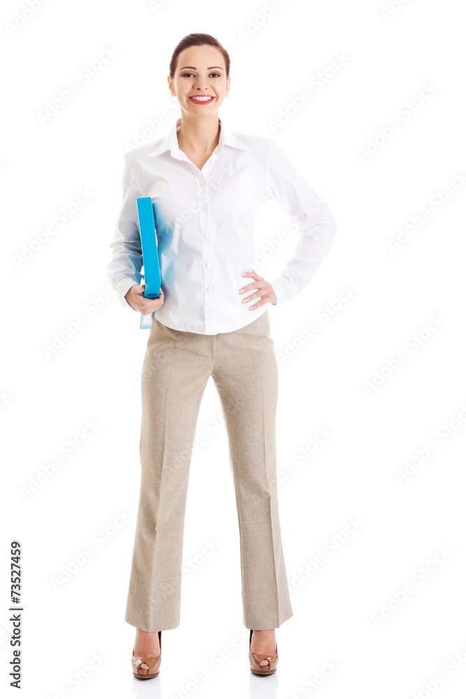 Full length businesswoman holding binder Full length businesswoman holding binder