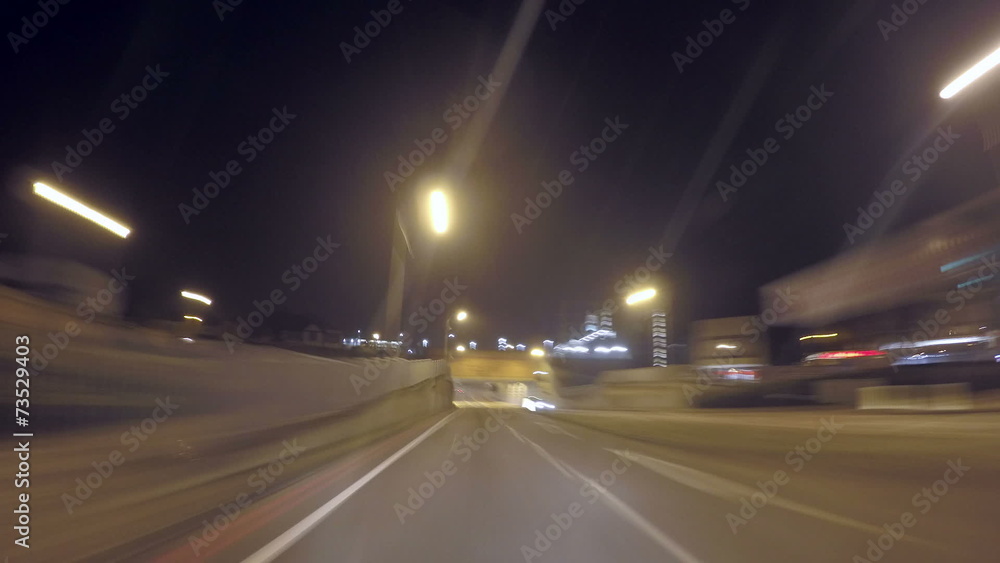 Time lapse at night of car driving along a road Time lapse at night of car driving along a road