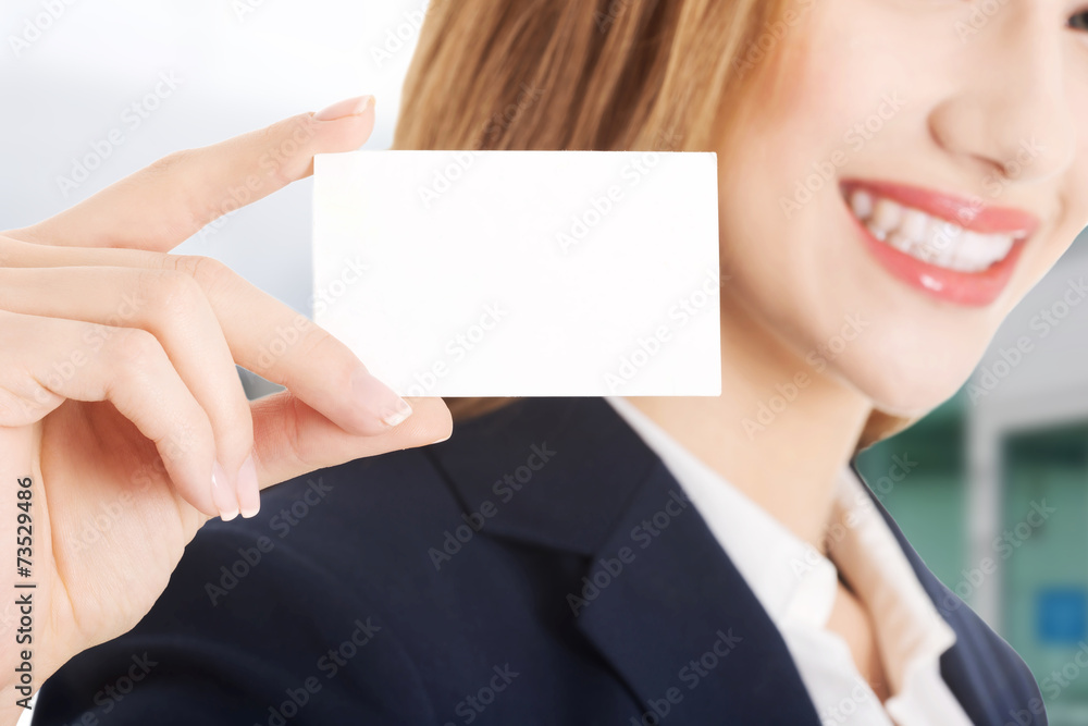 Beautiful caucasian woman holding small personal card. Beautiful caucasian woman holding small personal card.