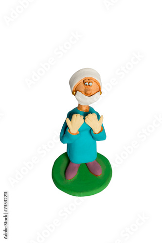 Statuette of a woman surgeon before surgery