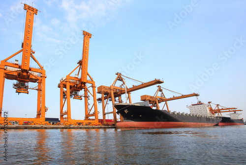 big container ship on port with big pier lifting crane  use for photo