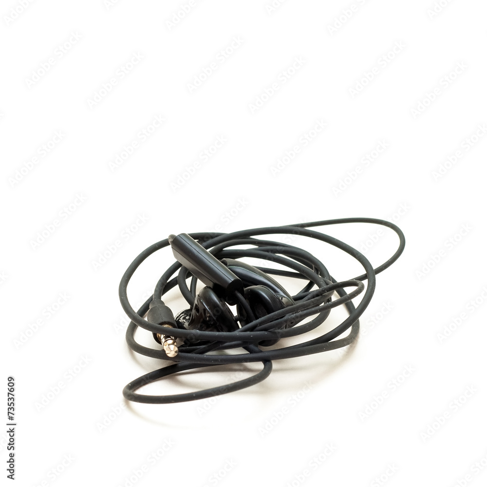 Tangled headphones isolated on a white background Tangled headphones isolated on a white background