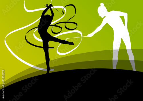 Active young girl gymnasts silhouettes in acrobatics flying ribb