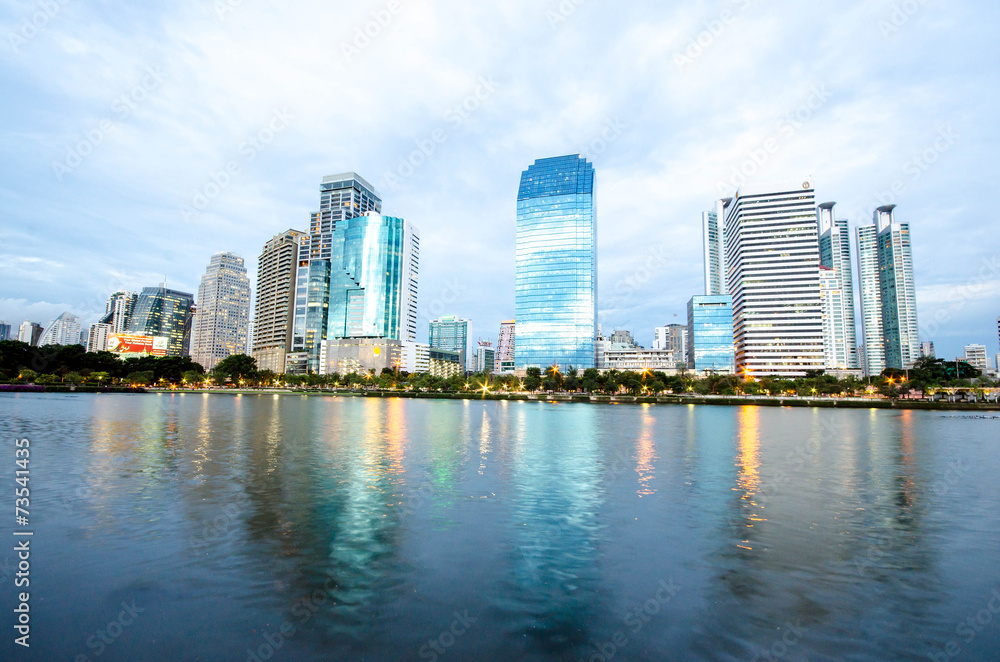 Fototapeta premium Bangkok city downtown at night with reflection of skyline, Bangk