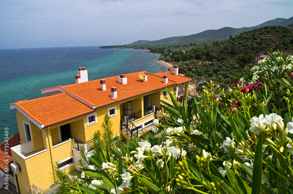 Houses surrounded by flowers on west coast of Thassos island