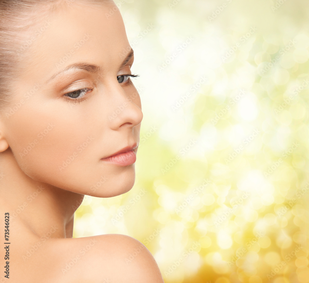 beautiful young woman over yellow background beautiful young woman over yellow background