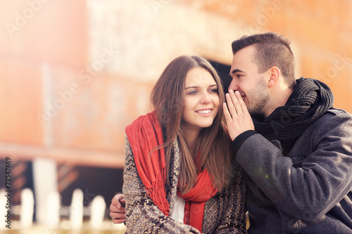 Canvastavla Young couple whispering on an autumn day