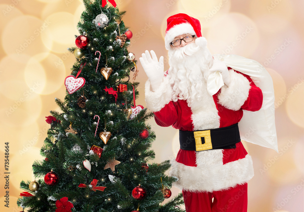 santa claus with bag and christmas tree santa claus with bag and christmas tree