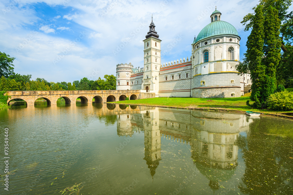 Reflection of Krasiczyn castle in a lake in summer, Poland