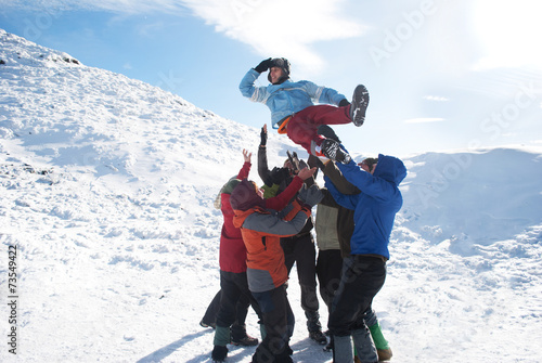 group of hikers have fun in winter mountains