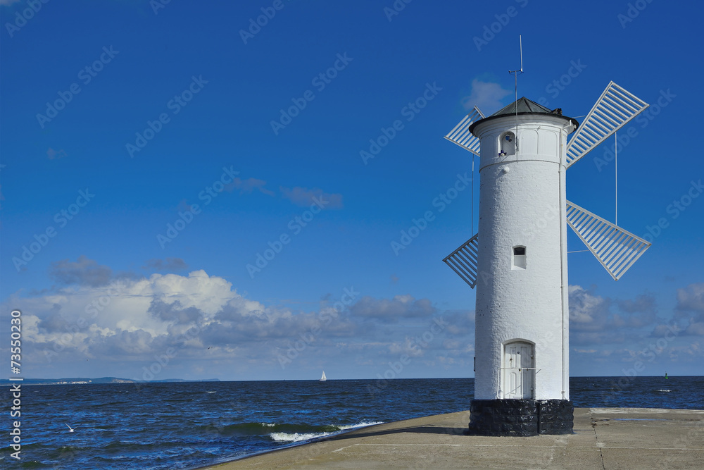 Lighthouse - windmill against the sky - Swinoujscie
