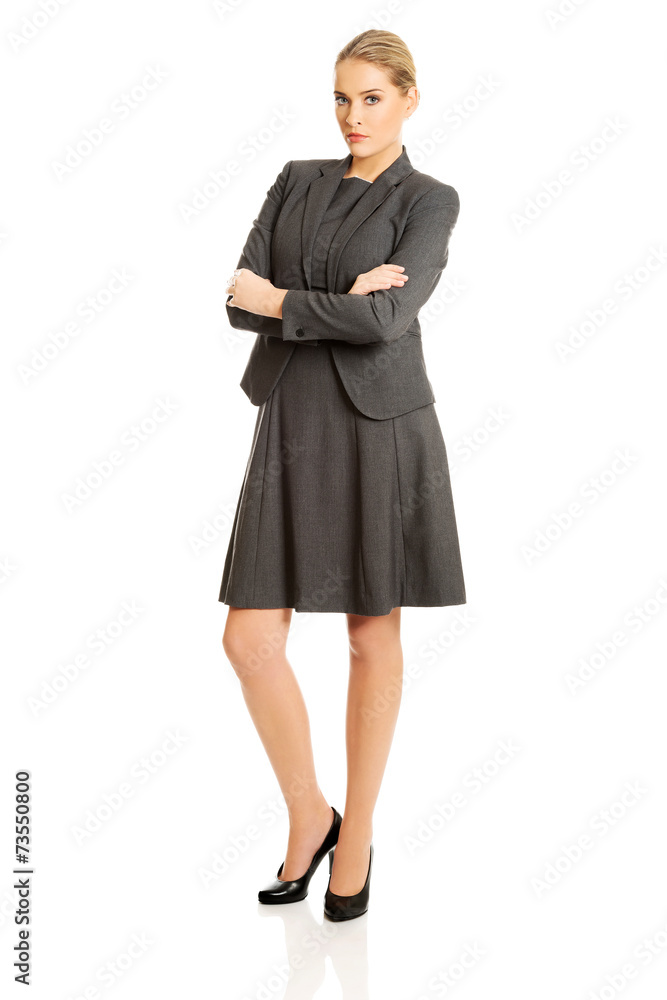 Businesswoman standing in confident pose Businesswoman standing in confident pose