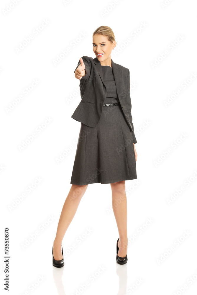 Young woman gesturing thumbs up Young woman gesturing thumbs up