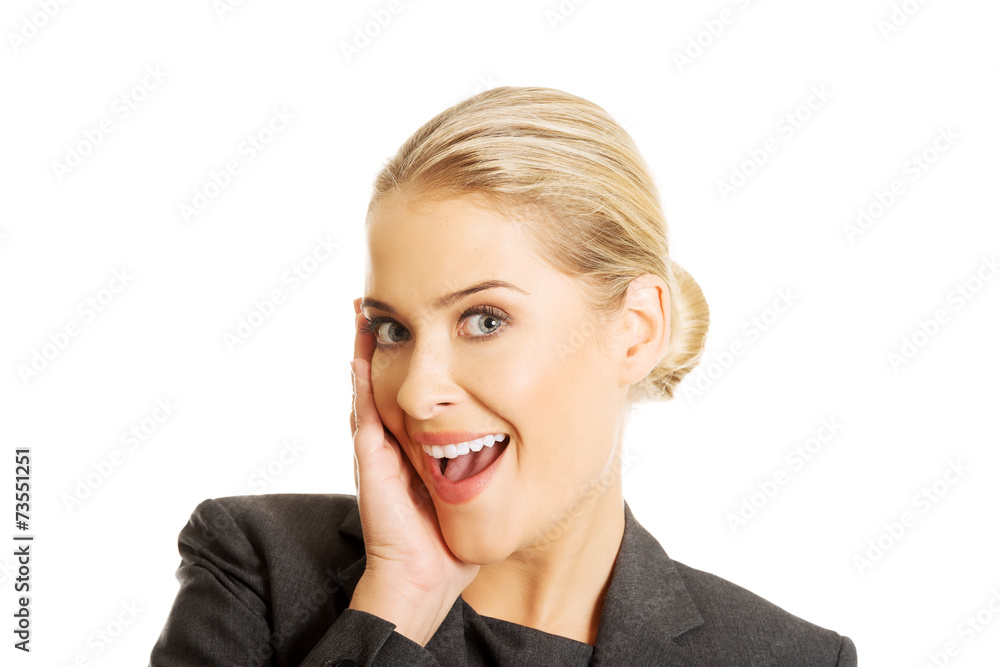 Portrait of amazed businesswoman holding hands on chin Portrait of amazed businesswoman holding hands on chin