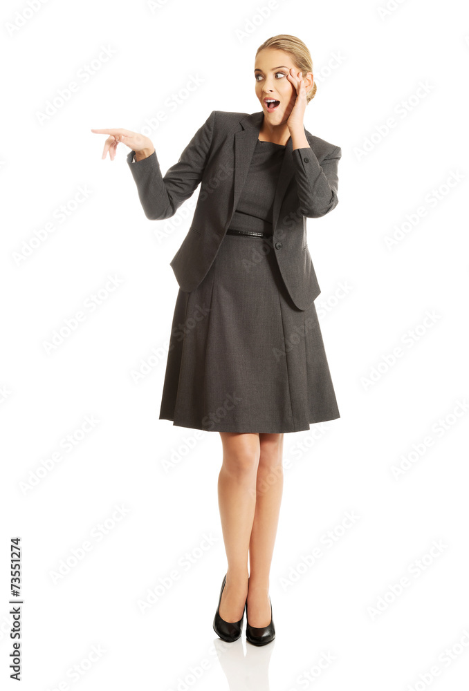 Portrait of amazed businesswoman holding hands on chin Portrait of amazed businesswoman holding hands on chin