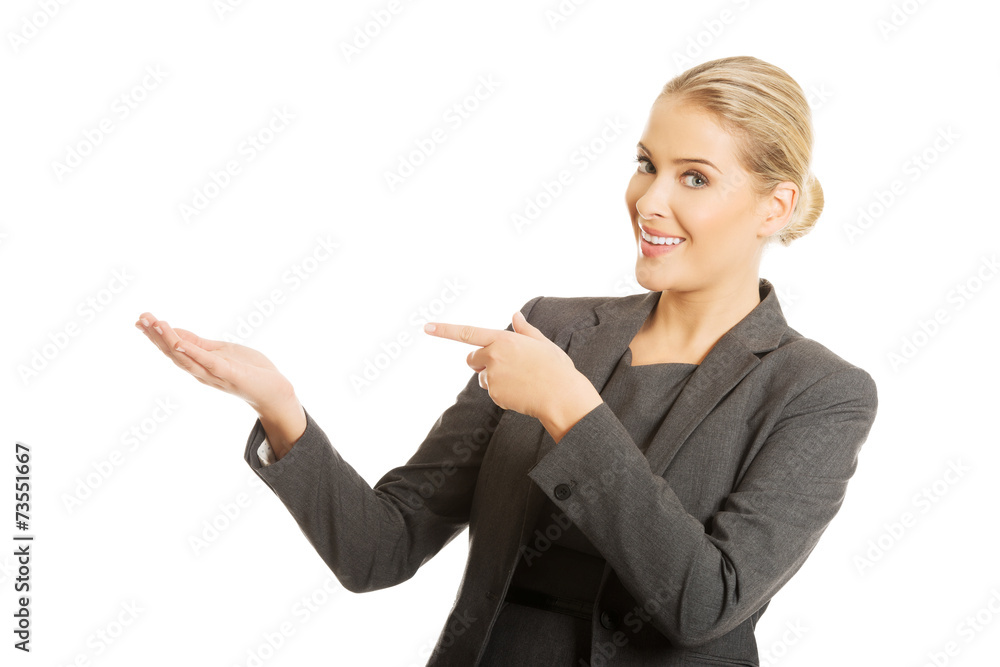 Business woman showing copy space on the left Business woman showing copy space on the left