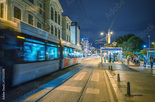 Istanbul train arriving in Sultanahmet Square at night photo