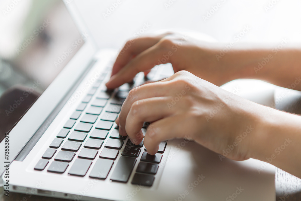 Closeup of business woman hand typing on laptop keyboard Closeup of business woman hand typing on laptop keyboard