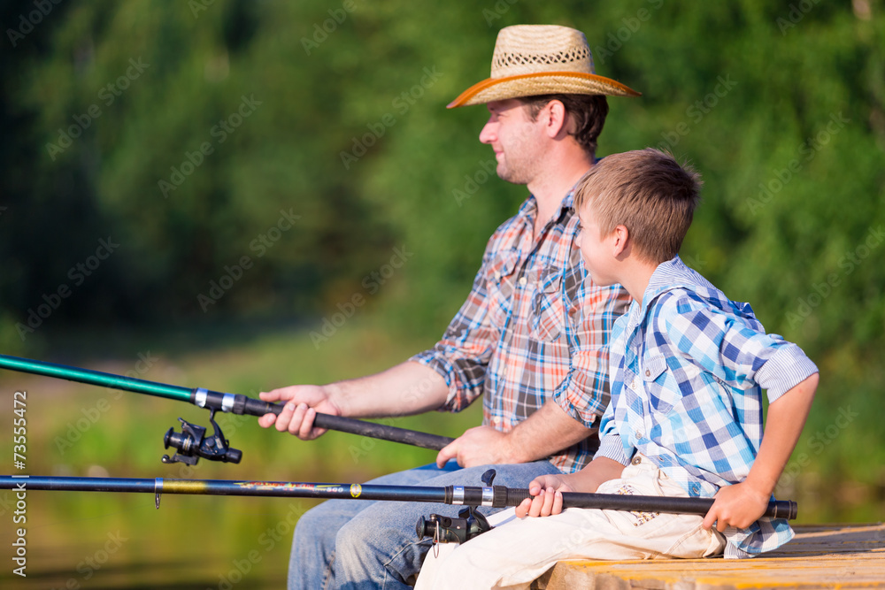 boy and his father fishing togethe boy and his father fishing togethe