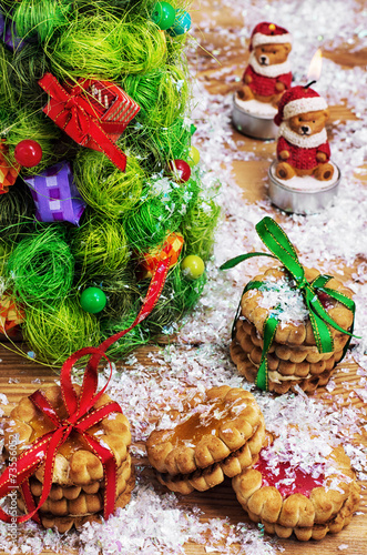 Fototapeta Naklejka Na Ścianę i Meble -  fragrant cookies on background of decorated Christmas ornaments