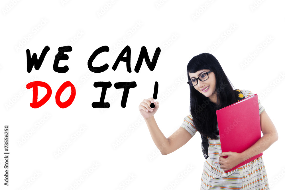 Female student writes motivation word 2 Female student writes motivation word 2