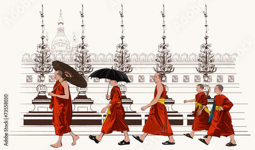 Buddhist monks walking in a temple