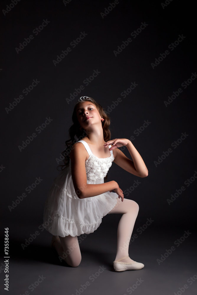 Image of smiling young ballerina posing in studio Image of smiling young ballerina posing in studio