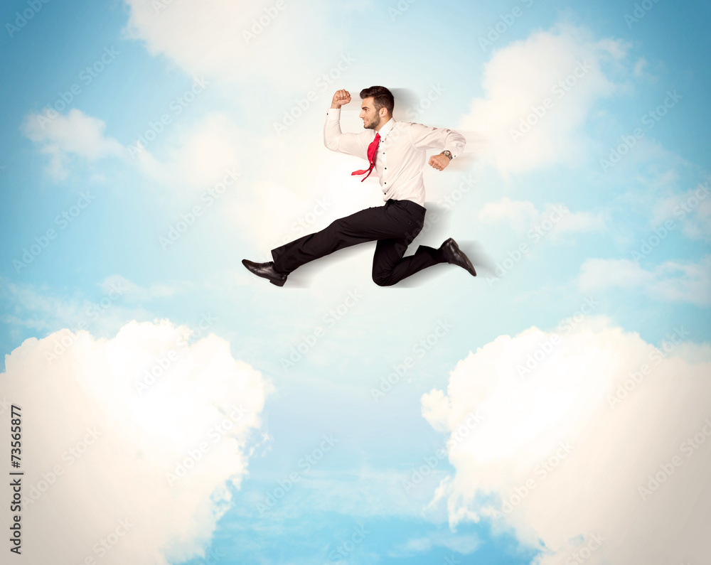 Business person jumping over clouds in the sky Business person jumping over clouds in the sky