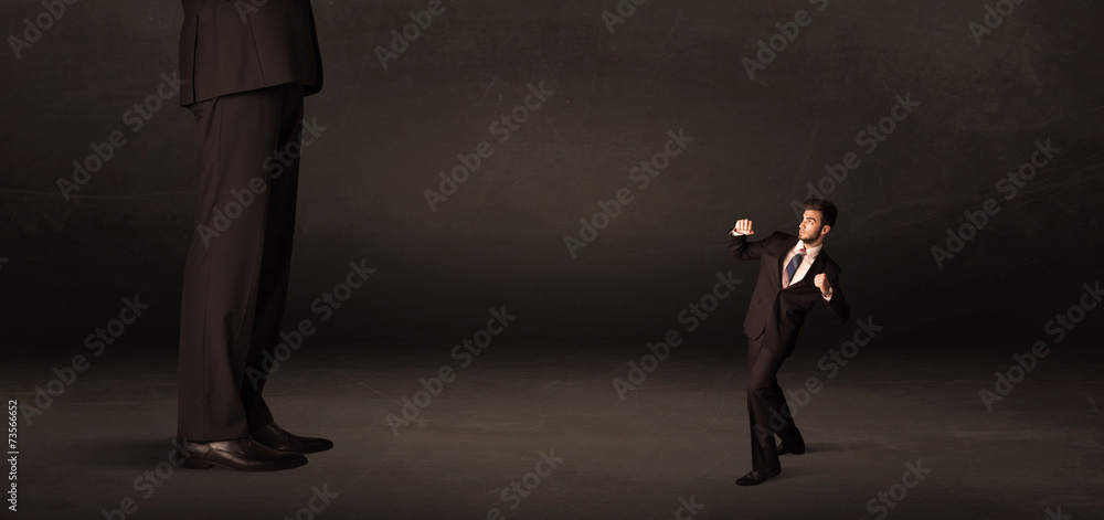 Huge man with small businessman standing at front concept