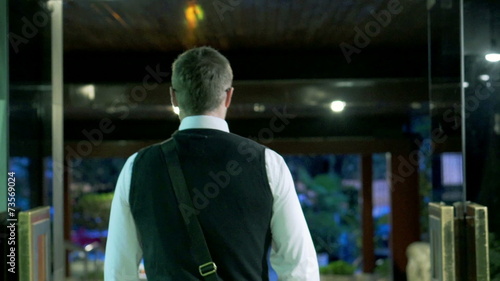 Man leaving building after work and going outside, steadycam 
