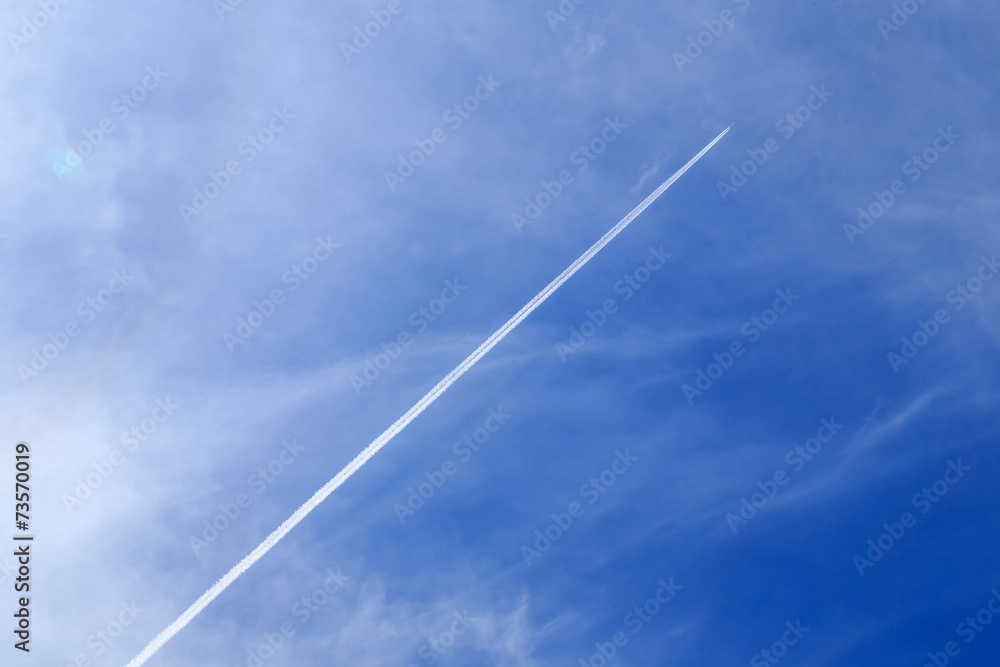contrails of aircraft against a blue sky. routes in airways contrails of aircraft against a blue sky. routes in airways