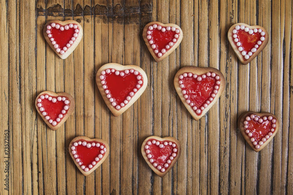 Red hearts cookies on wooden background Red hearts cookies on wooden background