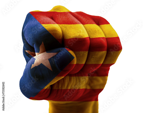 Catalonia flag on fist isolated on white photo