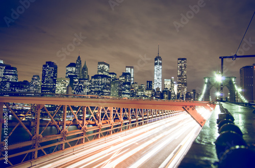 New York city night skyline from Brooklyn bridge photo