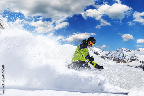 Skier in high mountains