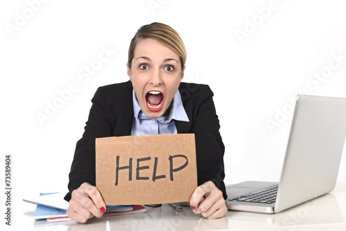 young stressed businesswoman holding help sign overworked photo