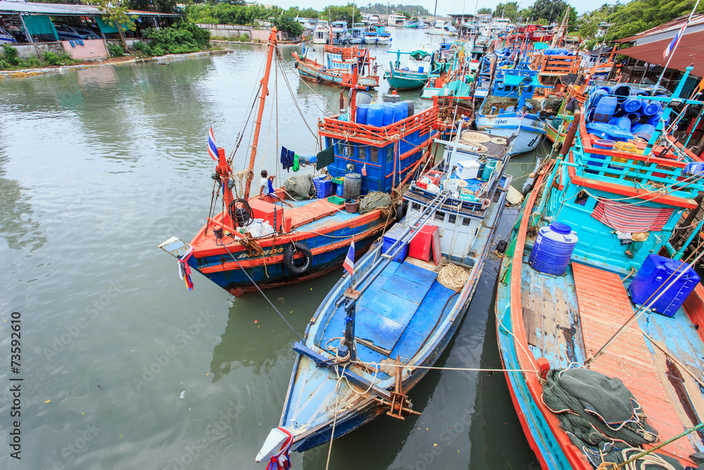 PHUKET - JULY 27 : Fishing boats stand in the harbor To transpor